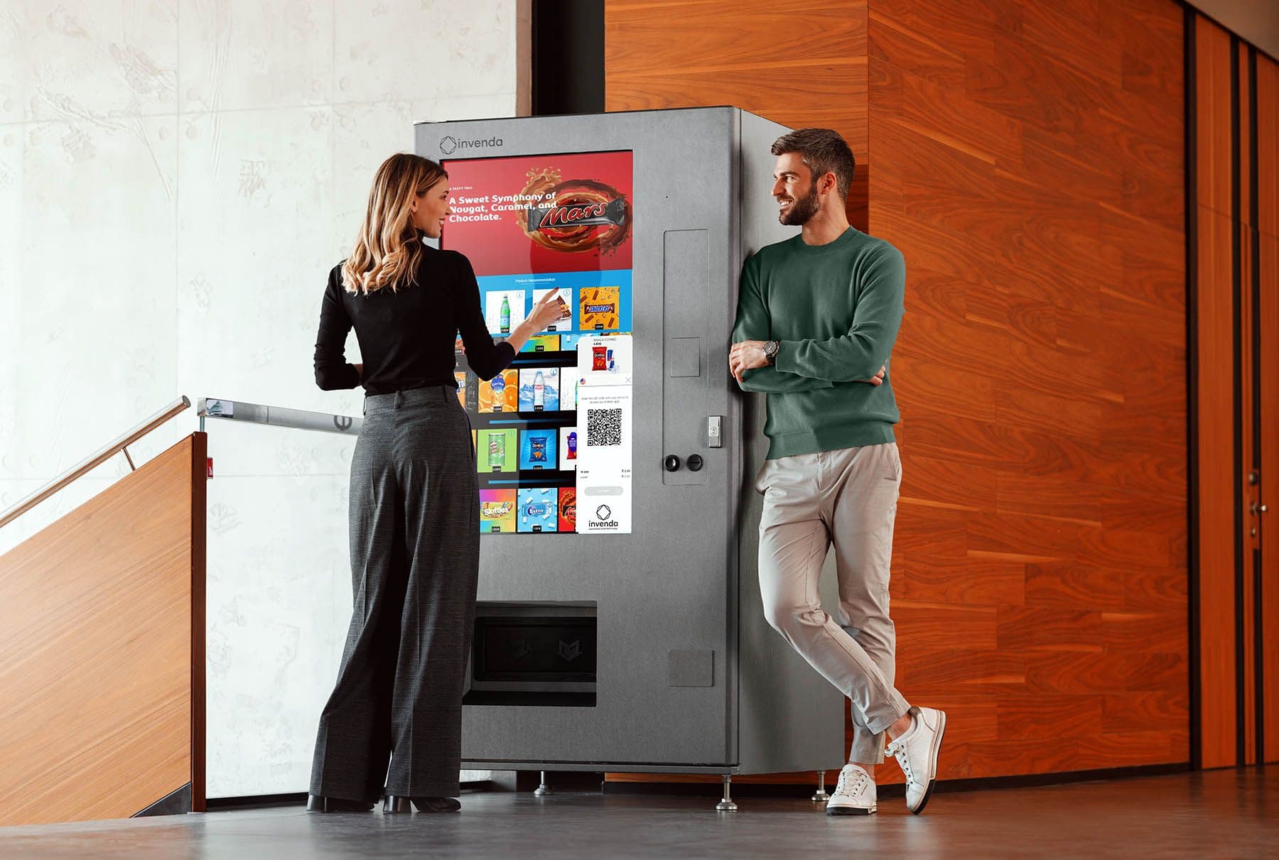 Woman and man in front of smart vending machine